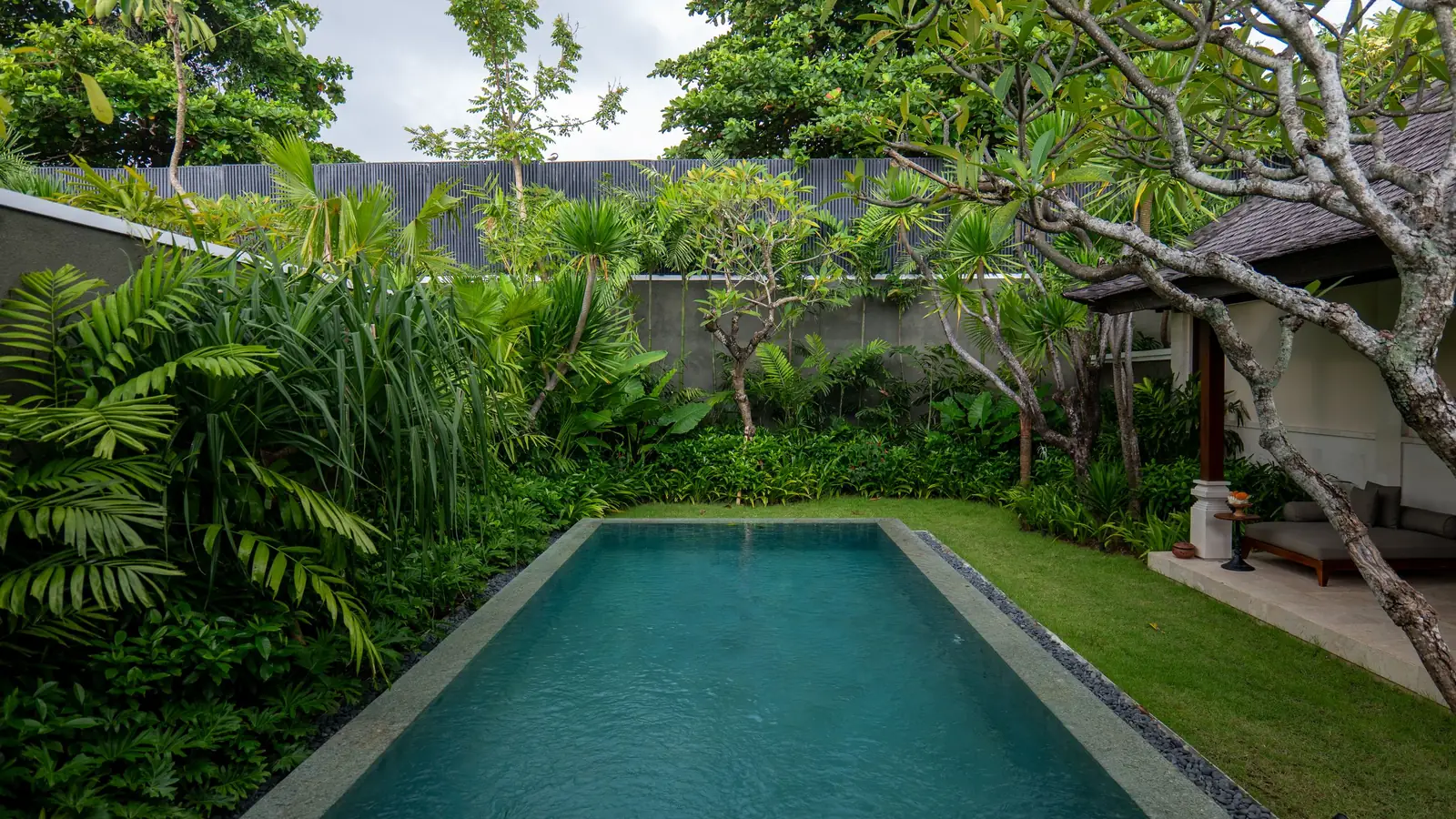Villa pool surrounded by a tropical garden in Bali